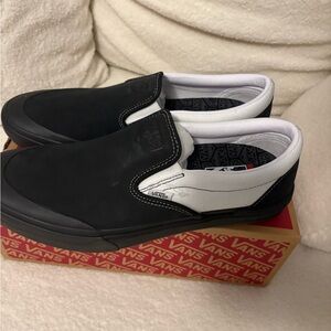 Vans Black and White Slip-On Shoes